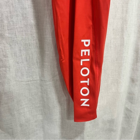 Athleta x Peloton Velocity 7/8 Orange Leggings with Zipper Pouch - Picture 4 of 11
